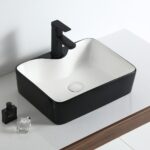 Bowl bicolor negro con fondo blanco de loza vitrificada, diseño moderno y fácil de limpiar para baños elegantes.