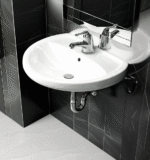 Lavatorio Eco Trebol: loza vitrificada, garantía de por vida, cambio de agua solo 2,5 L. Compacto, duradero y estilizado para baños exigentes
